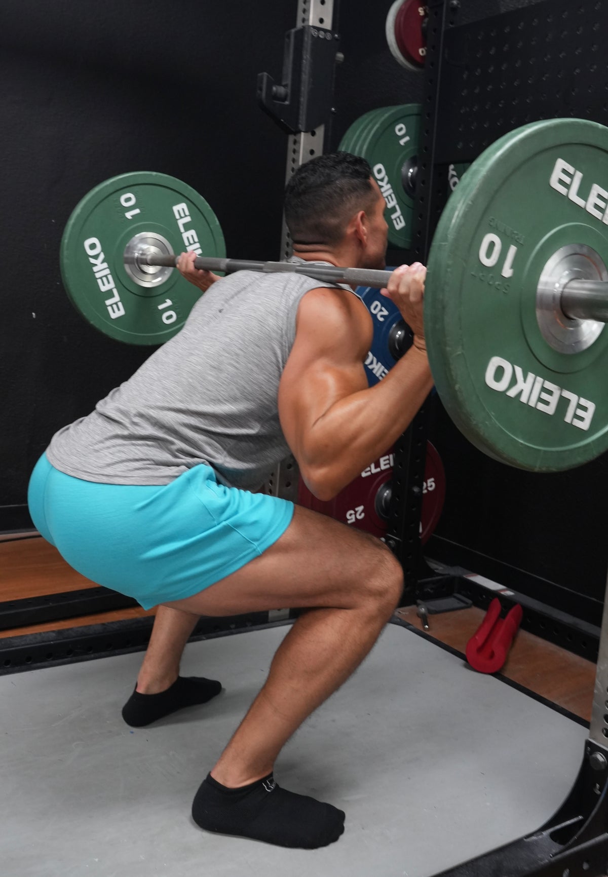 Athletic man wearing Roanhorse merino wool performance shorts